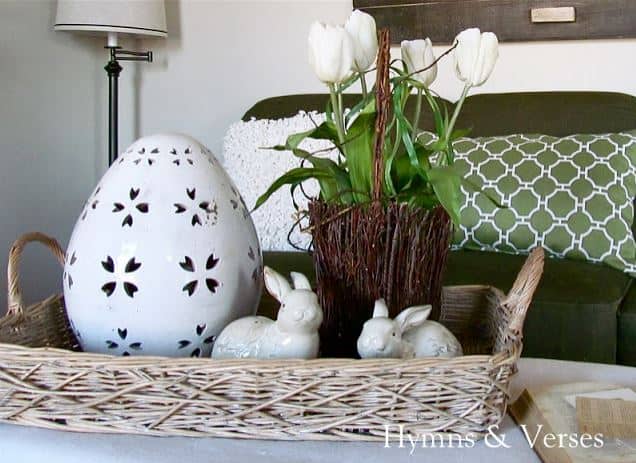 A basket tray with bunnies and an egg.