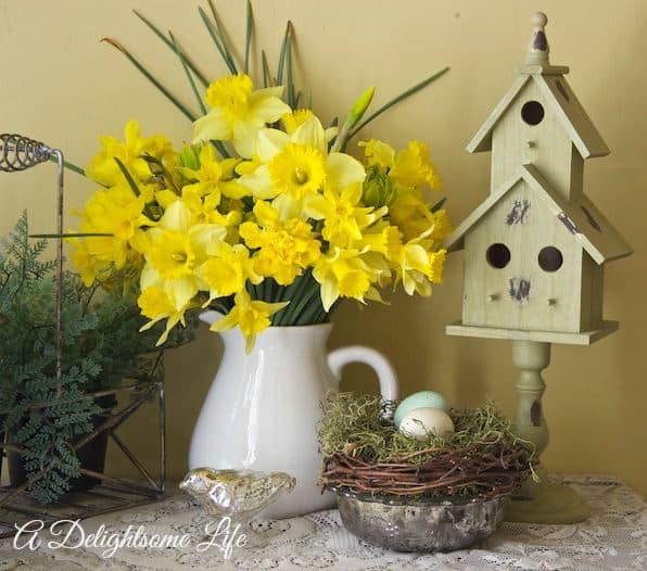 White vase and yellow flowers.