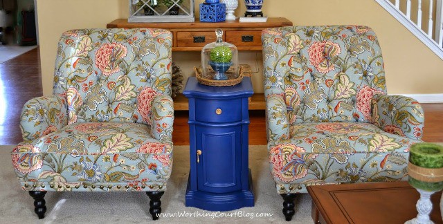 Two floral armchairs.