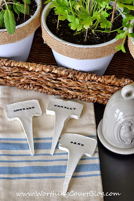 There are markers for the plants on a tea towel on the table.