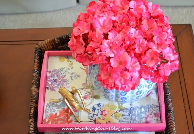 Inexpensive unfinished wood trays look great when made over with glossy spray paint, a piece of pretty wrapping paper and piece of glass cut to fit. :: WorthingCourtBlog.com