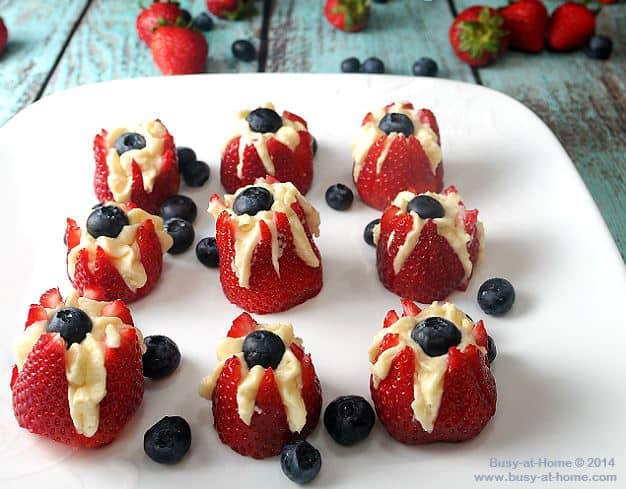  Cheesecake Berry Bites with strawberries and blueberries.