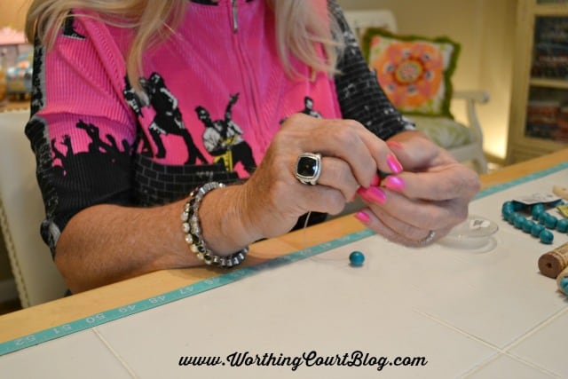 Stringing the turquoise beads.