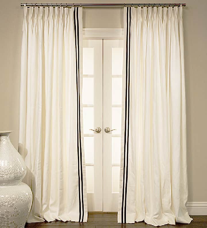 white curtains embellished with grosgrain ribbon