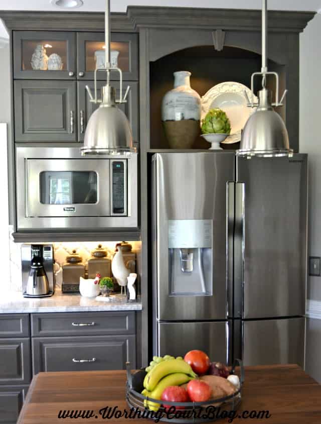 An open display cabinet above the refrigerator is perfect for showcasing special pieces.