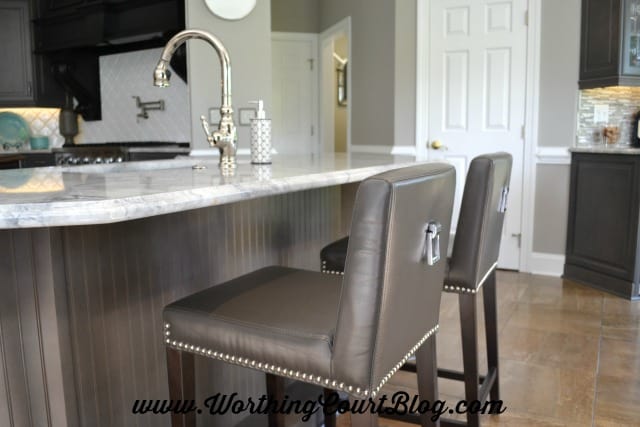 Barstools with polished nickel pulls and nailheads