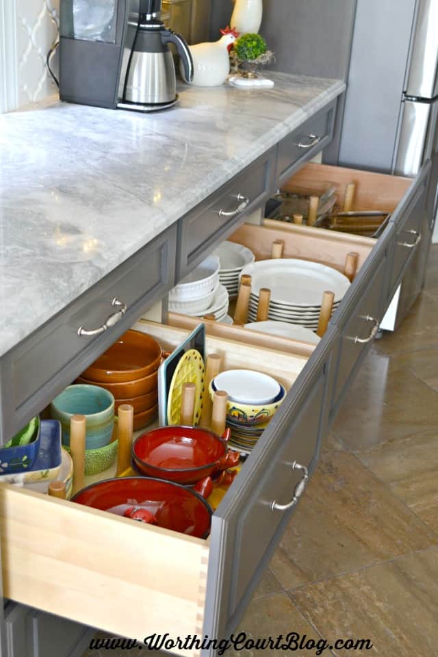 Peg organizers for kitchen drawers are moveable and keep dishes organized