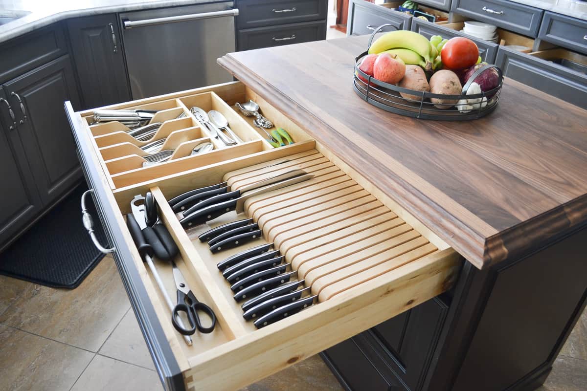 knife and utensil organizer inside a kitchen island