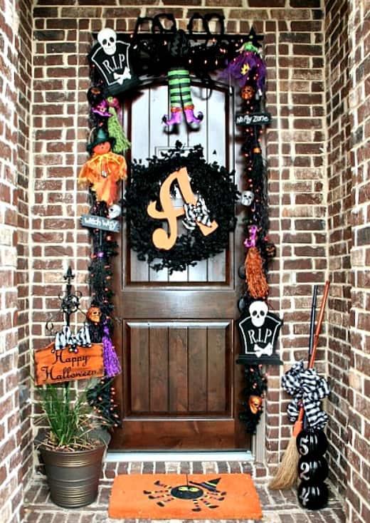 Outdoor Halloween Decorations with a black skeleton and purple and orange.