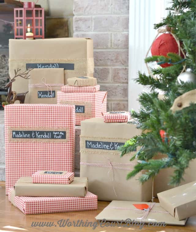 A decorated Christmas tree with wrapped presents under it.