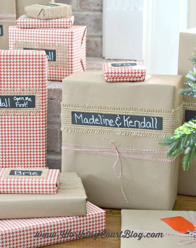 Large and small wrapped presents by the tree.