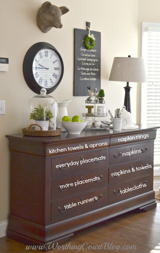 Use a dresser in the kitchen to hold kitchen & dining linens, act as a sideboard and to display your pretties.