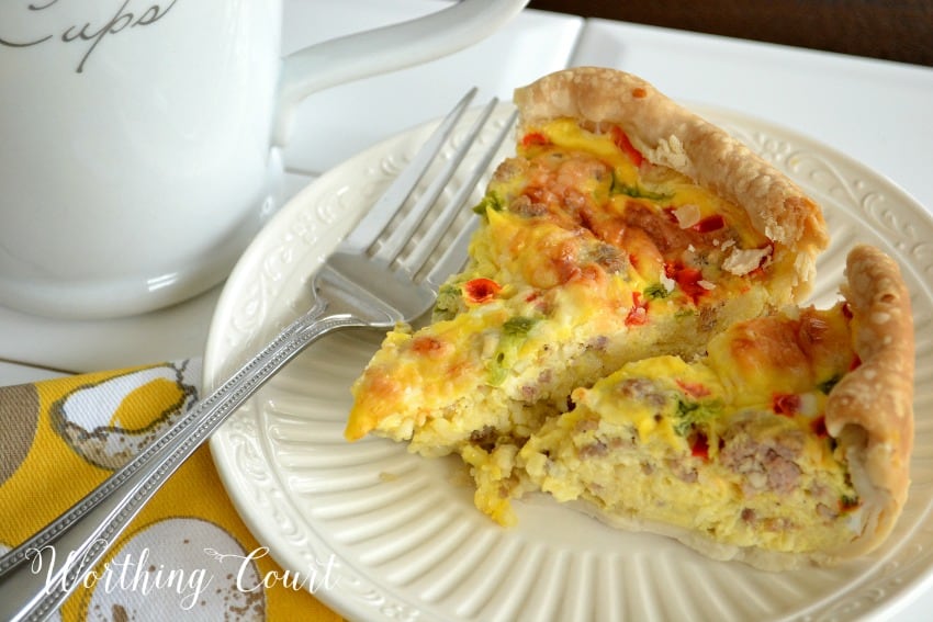 Breakfast casserole scramble with a fork on a plate.