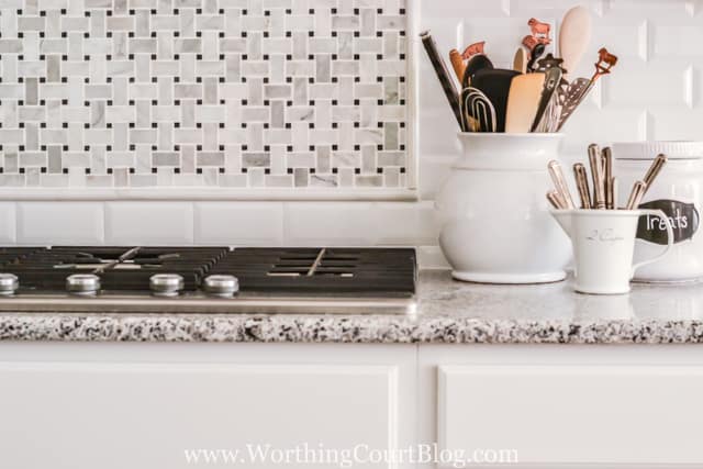 Basket weave tile behind the stove.