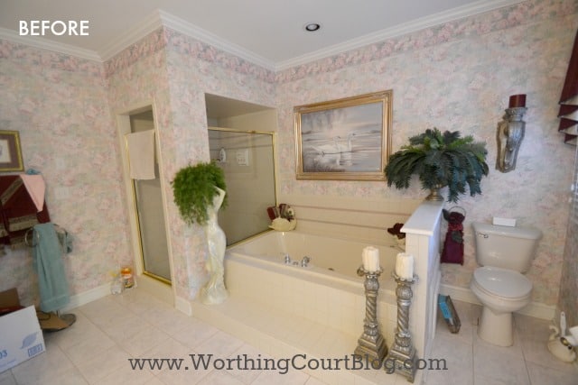 Master Bath Before Photo with wallpaper on the walls.