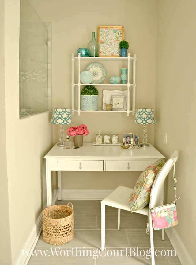 An old desk recyled into a master bathroom dressing table and makeup vanity.