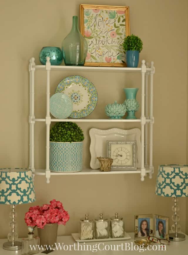 Hanging shelves above a dressing table and makeup vanity in the master bathroom