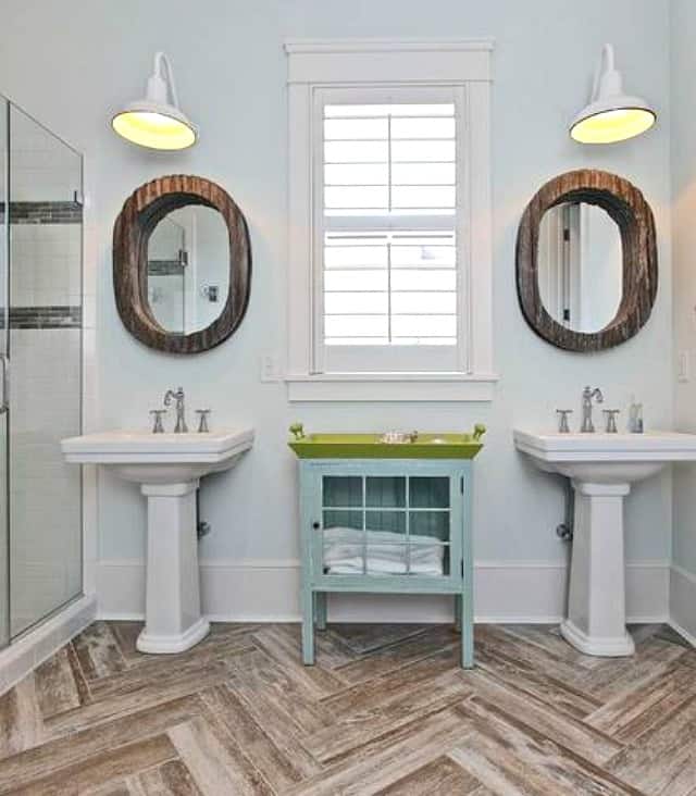 Faux bois ceramic tile floor with wooden mirrors in the bathroom.