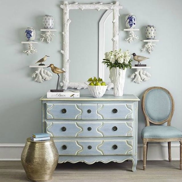 White Faux Bois Mirror above a dresser in the bedroom.