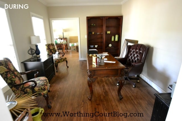 Office with a small desk and wooden floor.