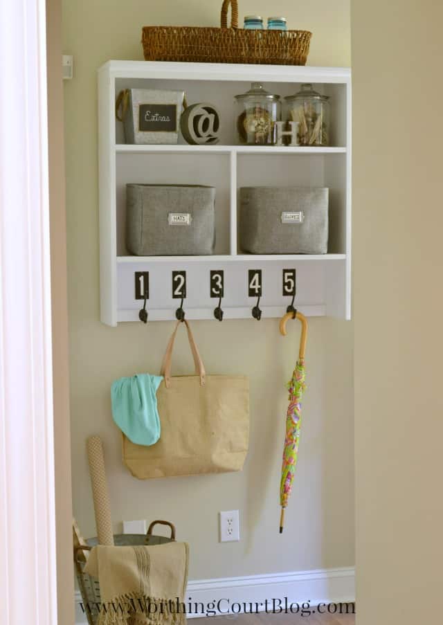 Old hutch repurposed into a mudroom dropzone