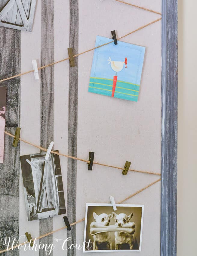 Run twine across a bulletin board and use cute clothespins to display small cards and pictures.