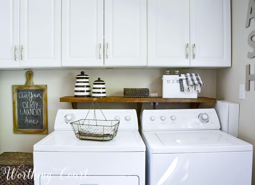 There is a wire basket on the washing machine.