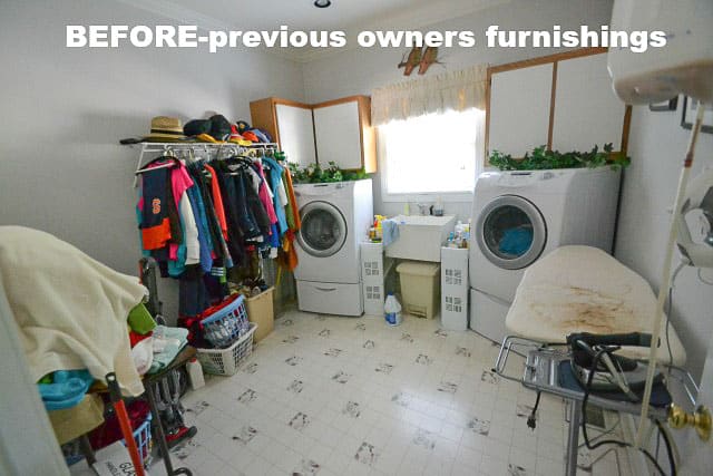 Laundry room BEFORE with previous owner's belongings.