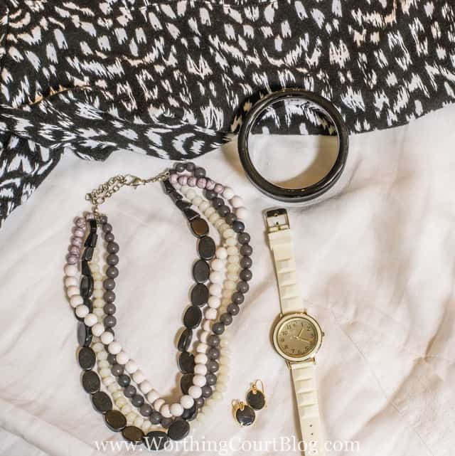 Classic black and white jewlery on the black and white outfit.