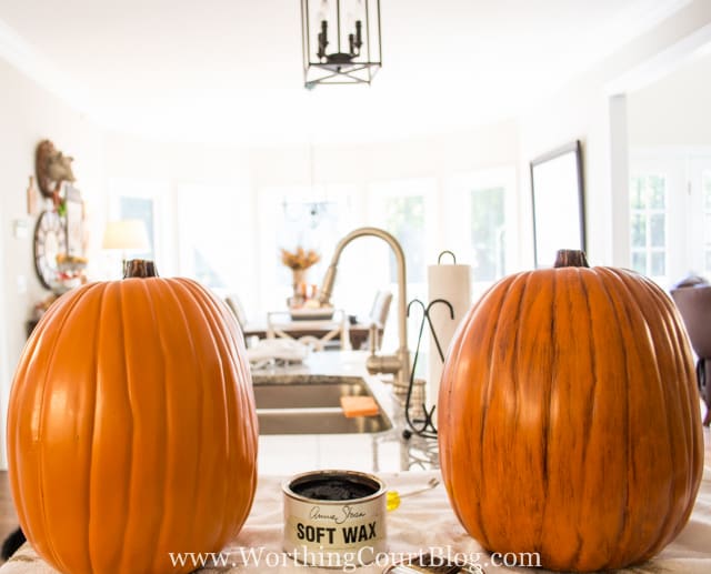 Before and after of bright orange pumpkin with dark stain applied and wiped off to achieve the desired color