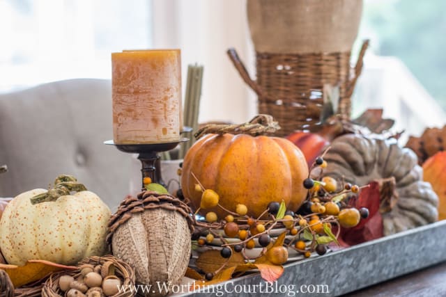 A galvanized tray filled with fall decor.