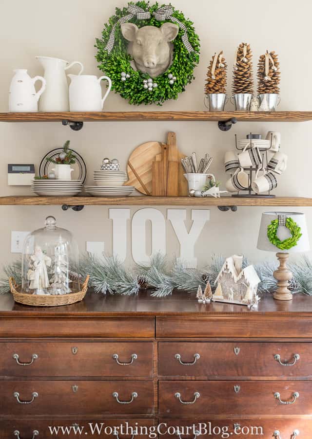 The rustic open shelves and sideboard decorated for Christmas.