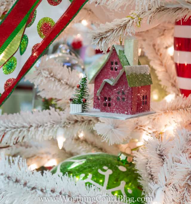 An adorable little house tucked into a Christmas tree