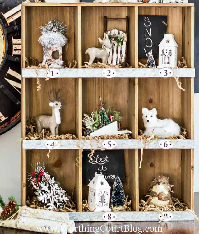 Rustic Farmhouse Christmas Cubbies filled with Christmas decor items.