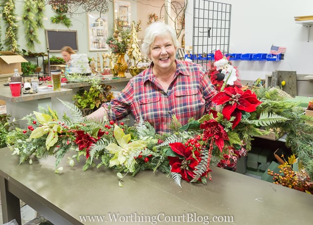 A woman holding the pretty garland.