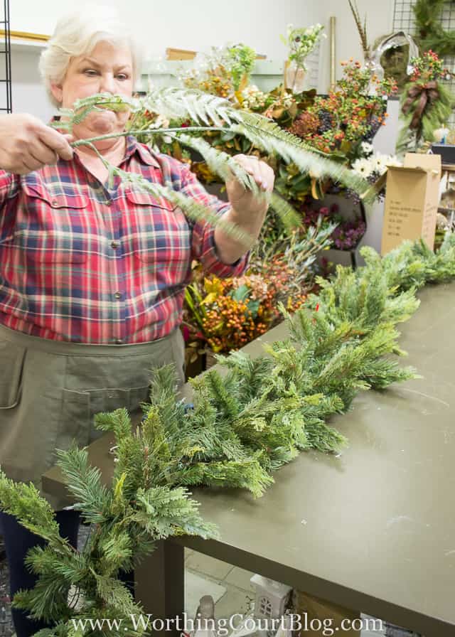 Cutting the branches apart, trimming the greens.