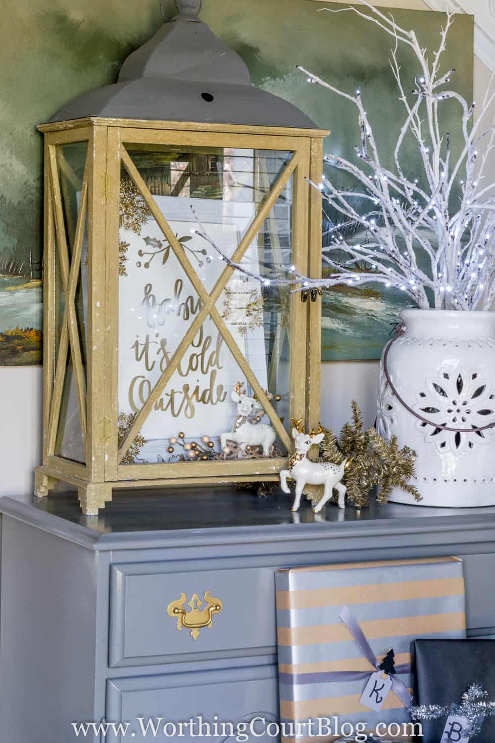 A rustic lantern with the print inside it.