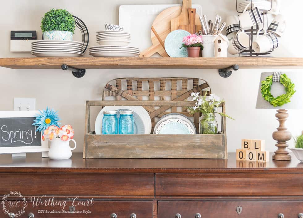 Open shelves decorated with spring items.