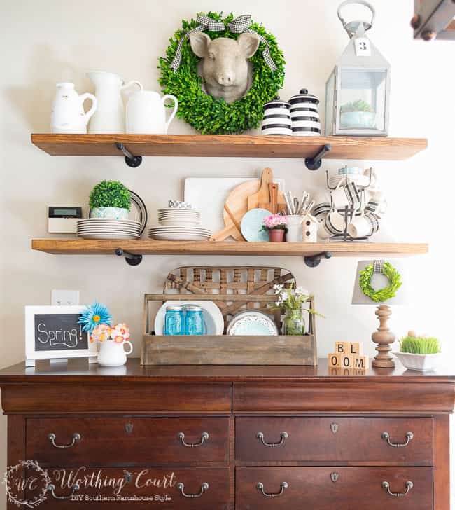 Rustic farmhouse open shelves decorated for spring.