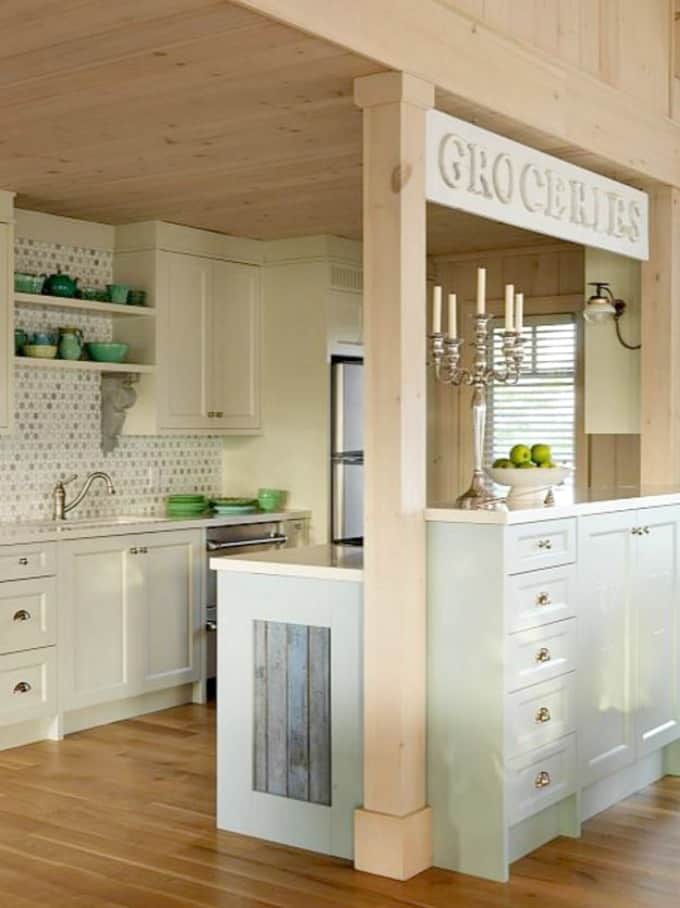 A neutral kitchen with white cabinets.