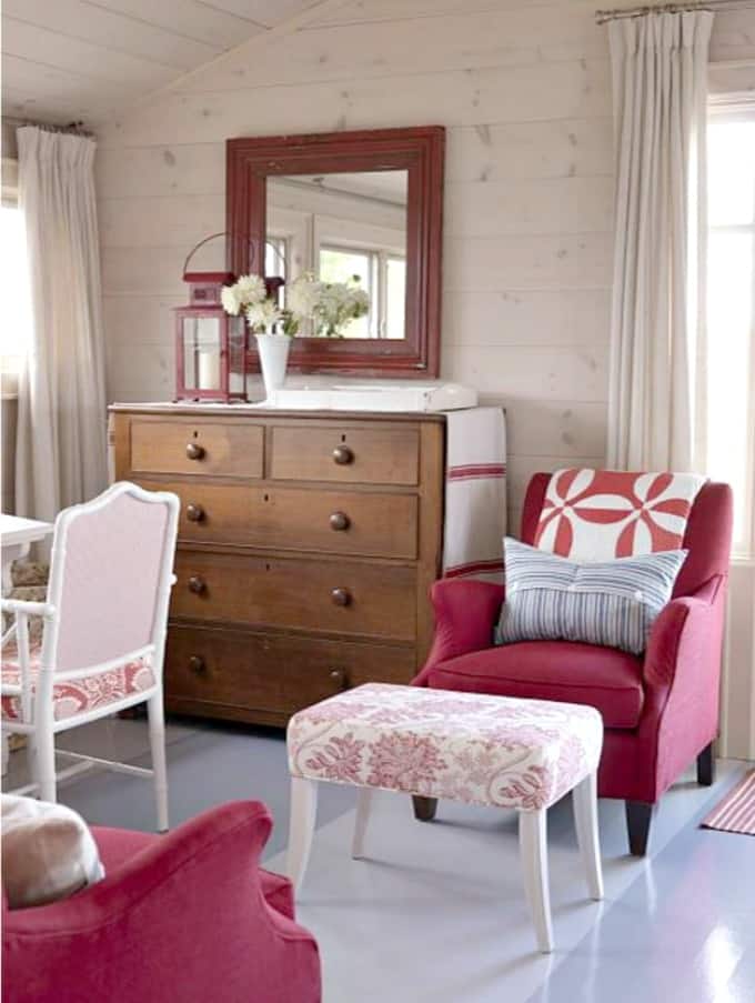 Red armchair in the master bedroom.