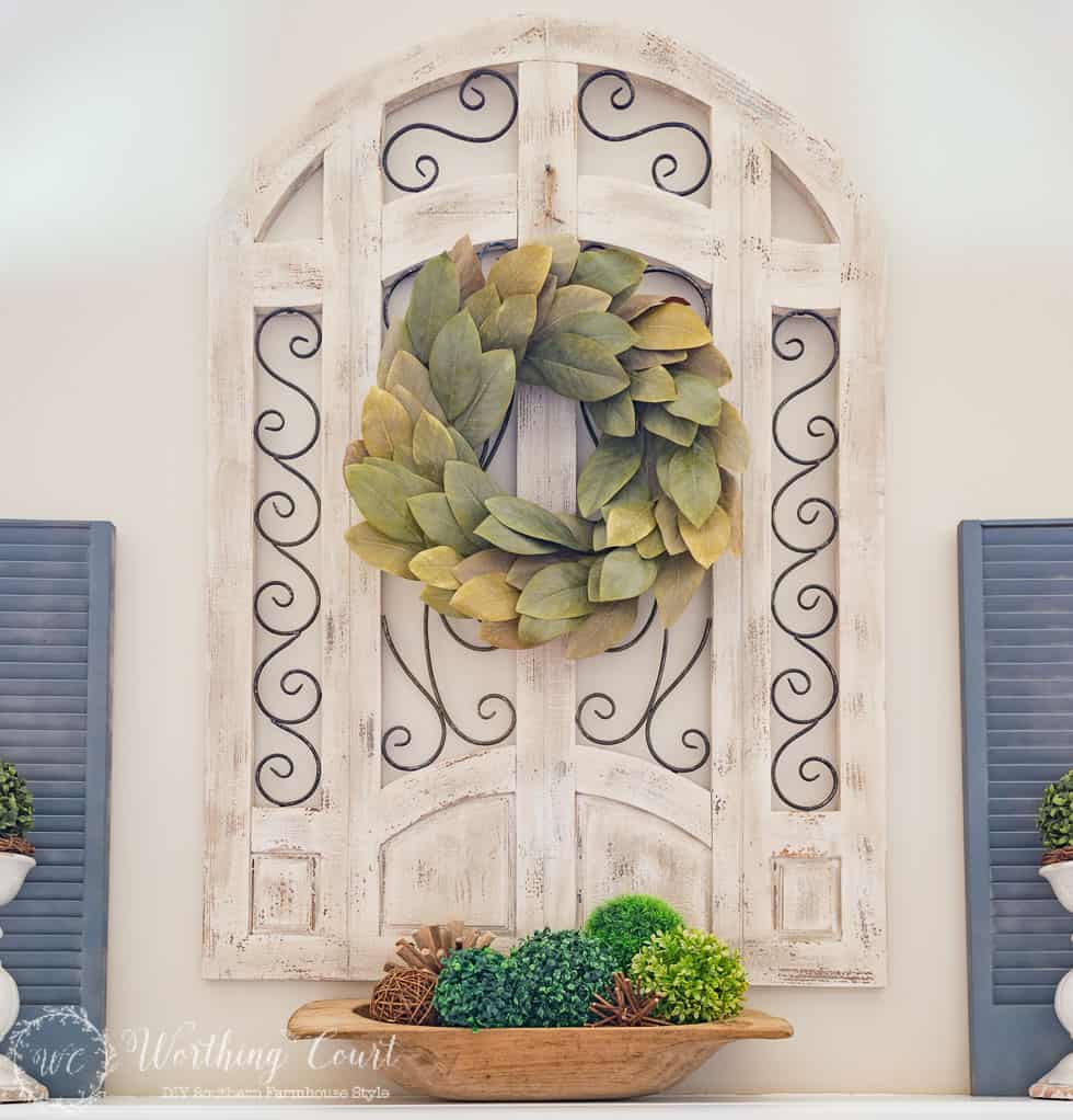 A pretty magnolia wreath above the fireplace.