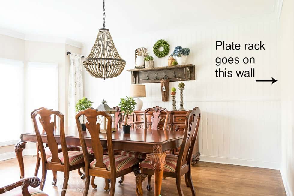 The dining room with an arrow pointing to where the plate rack will go on the wall.