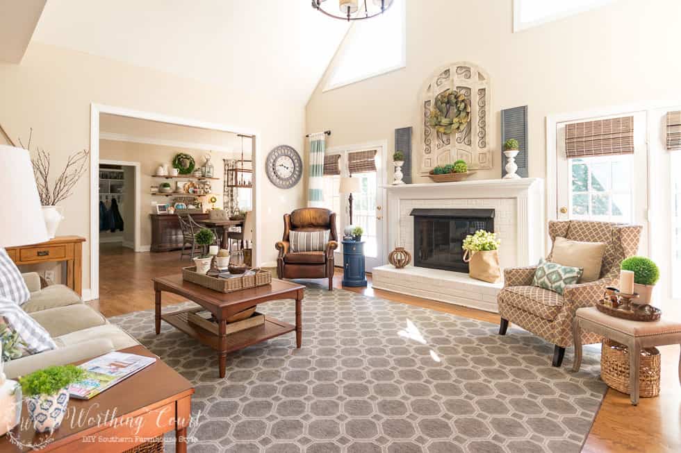 The before and after of this family room is amazing. It was taken from dark and dated to light and bright filled with rustic farmhouse touches.