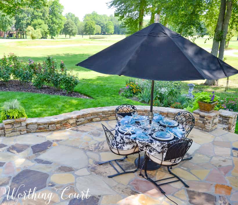 patio with dining table overlooking yard