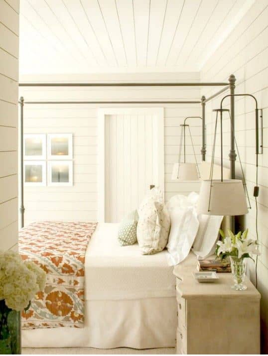 bedroom with white walls and neutral bedding