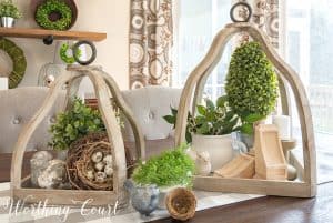 pair of wooden lanterns decorated for spring