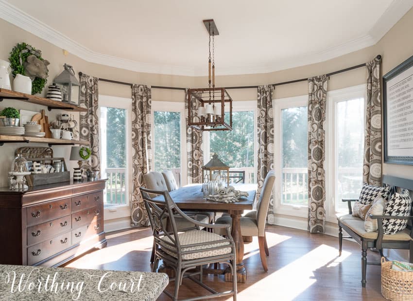 Farmhouse kitchen breakfast area with bay windows.