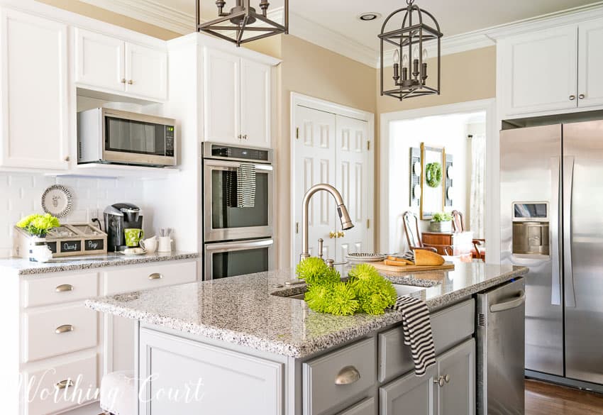 kitchen with white shaker cabinets and wall ovens