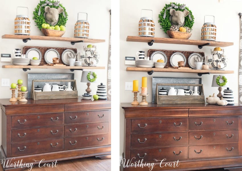 The open shelves decorated for fall with green apples, plates and a wreath around the pig head.